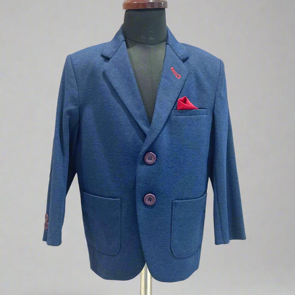 It’s a navy blue Colored boys wedding wear blazer that comes with a red pocket square. It features elbow patch detailing on sleeves.