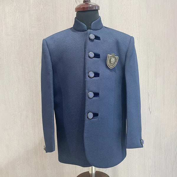  It’s a navy blue Colored boys wedding wear Jodhpuri coat that comes with an elegant broach.