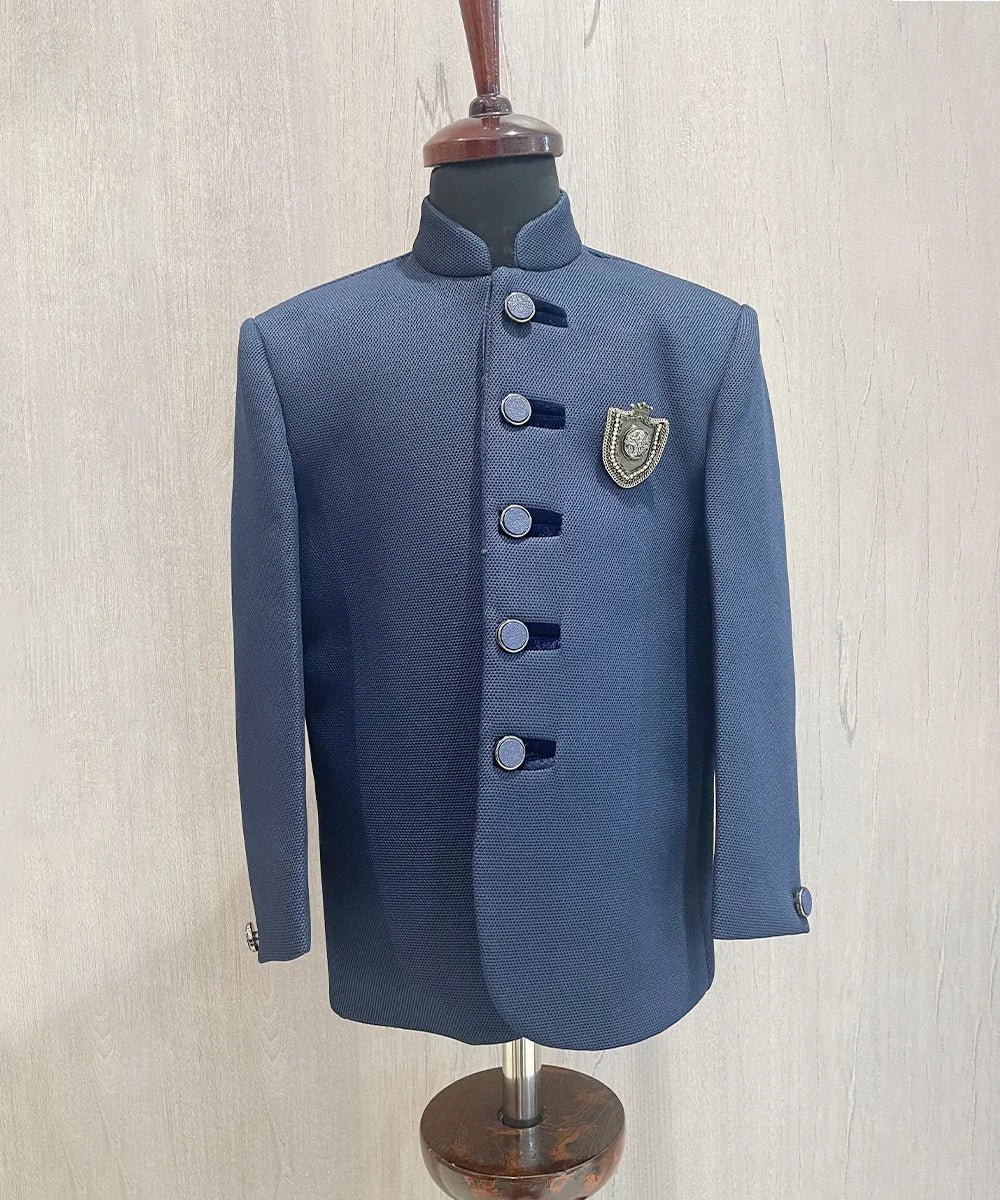  It’s a navy blue Colored boys wedding wear Jodhpuri coat that comes with an elegant broach.