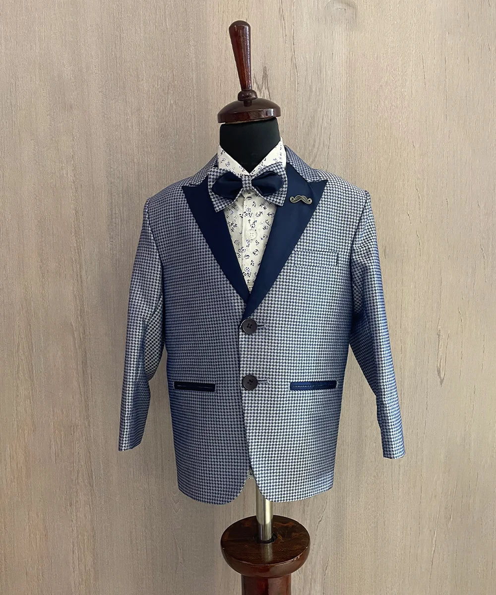 This boys wedding outfit consists of a blue Colored self-printed coat, matching pants and a white Colored printed shirt. It features a matching bow and a cute broach.