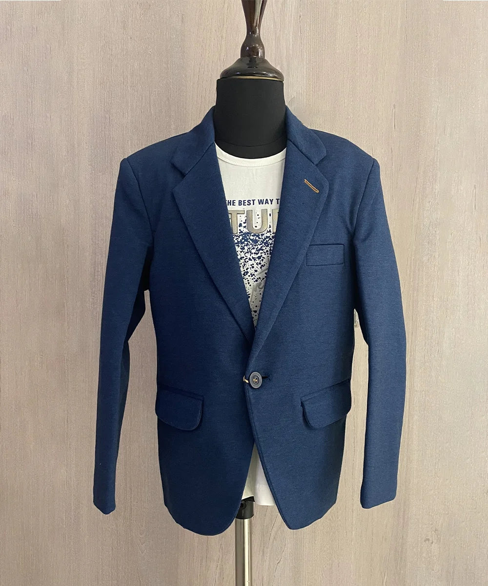 This boys wedding outfit consists of a Blue Colored Blazer and a matching self-printed white Colored t-shirt.