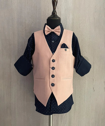 This boys party clothes set consists of a light pink Colored waistcoat, matching pants and a self-printed blue Coloured shirt. It features a matching bow, a cute broach and a printed pocket square that uplifts the entire look.