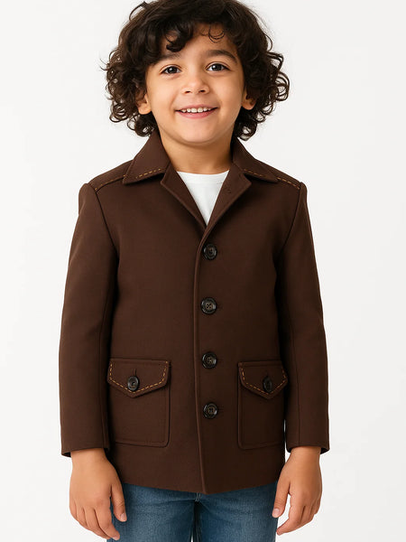 Child wearing a brown coat on a white background