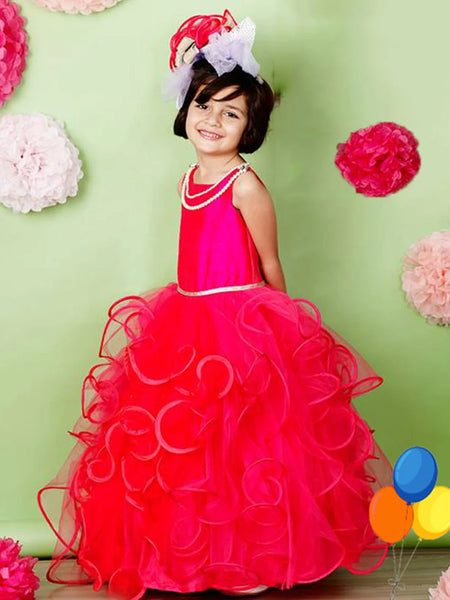  It’s a pink and red Colored party gown that comes with a back zip closure. It features lace and pearl detailing. Moreover, it also has a fabric belt to be tied at the back.