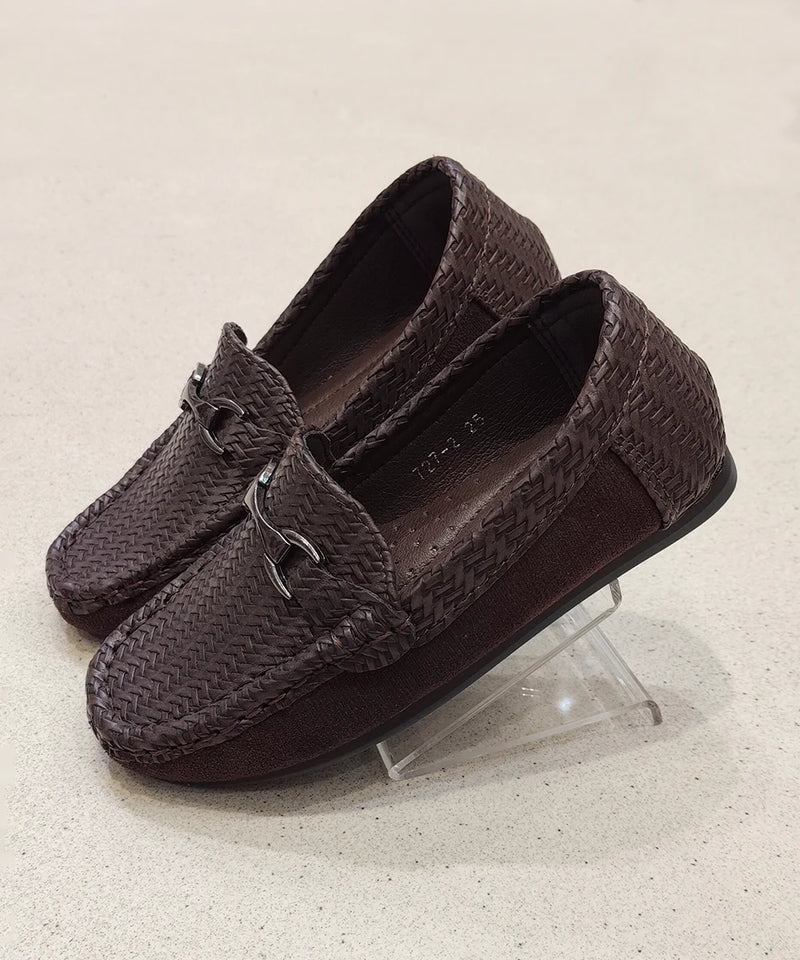 Pair of brown textured loafers on a clear stand against a light background