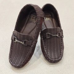 Pair of brown woven loafers on a light background