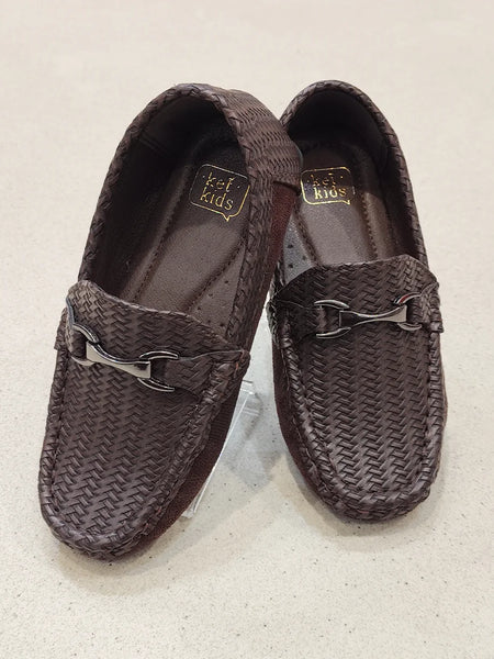 Pair of brown woven loafers on a light background