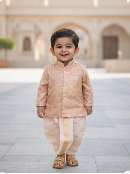 Child wearing a traditional outfit standing in an outdoor setting with arches in the background