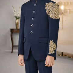 Navy suit with gold embroidery in a room setting