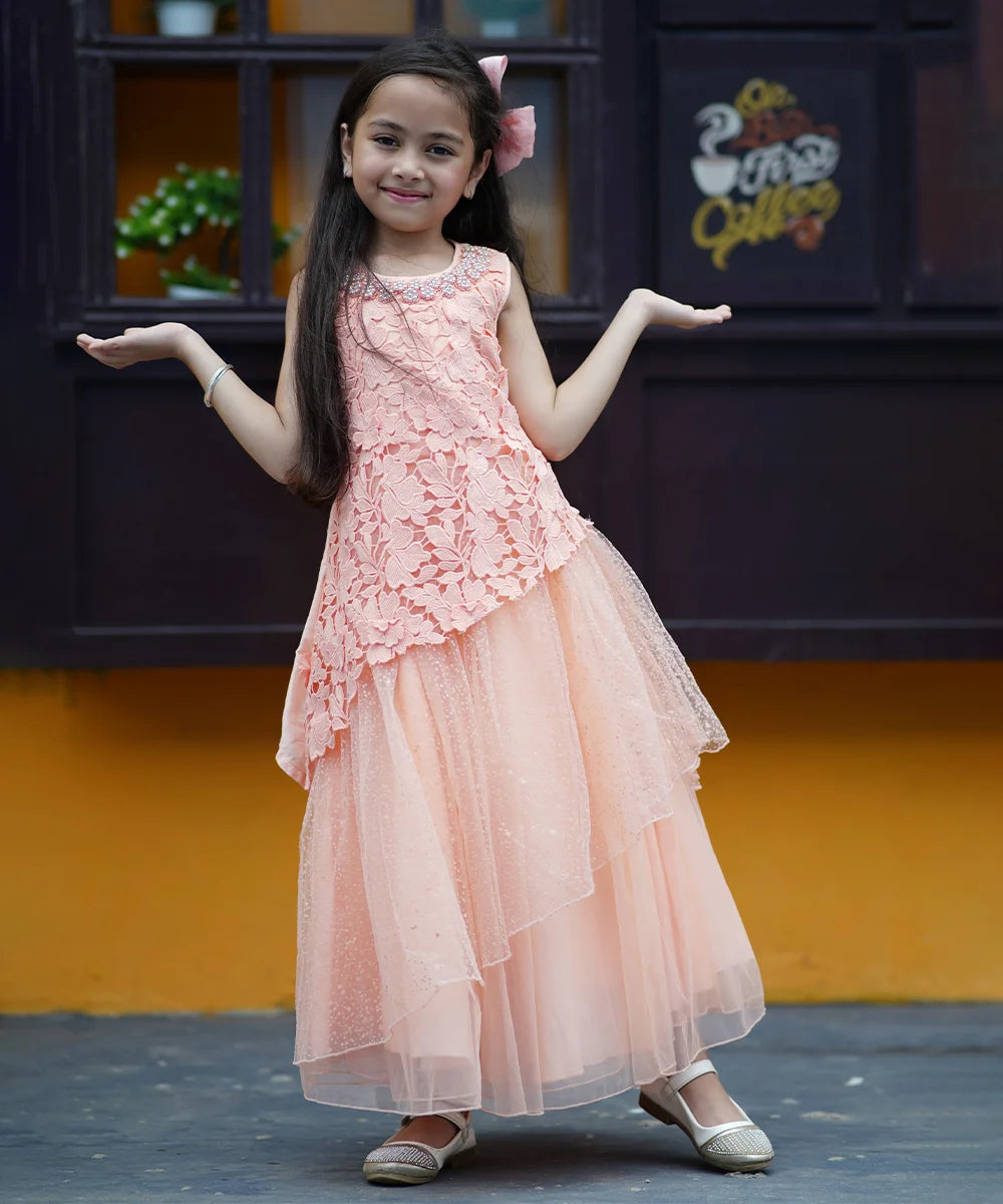 Peach Colored Laced Party Gown with stone and pearl work detailing on neck for Girls