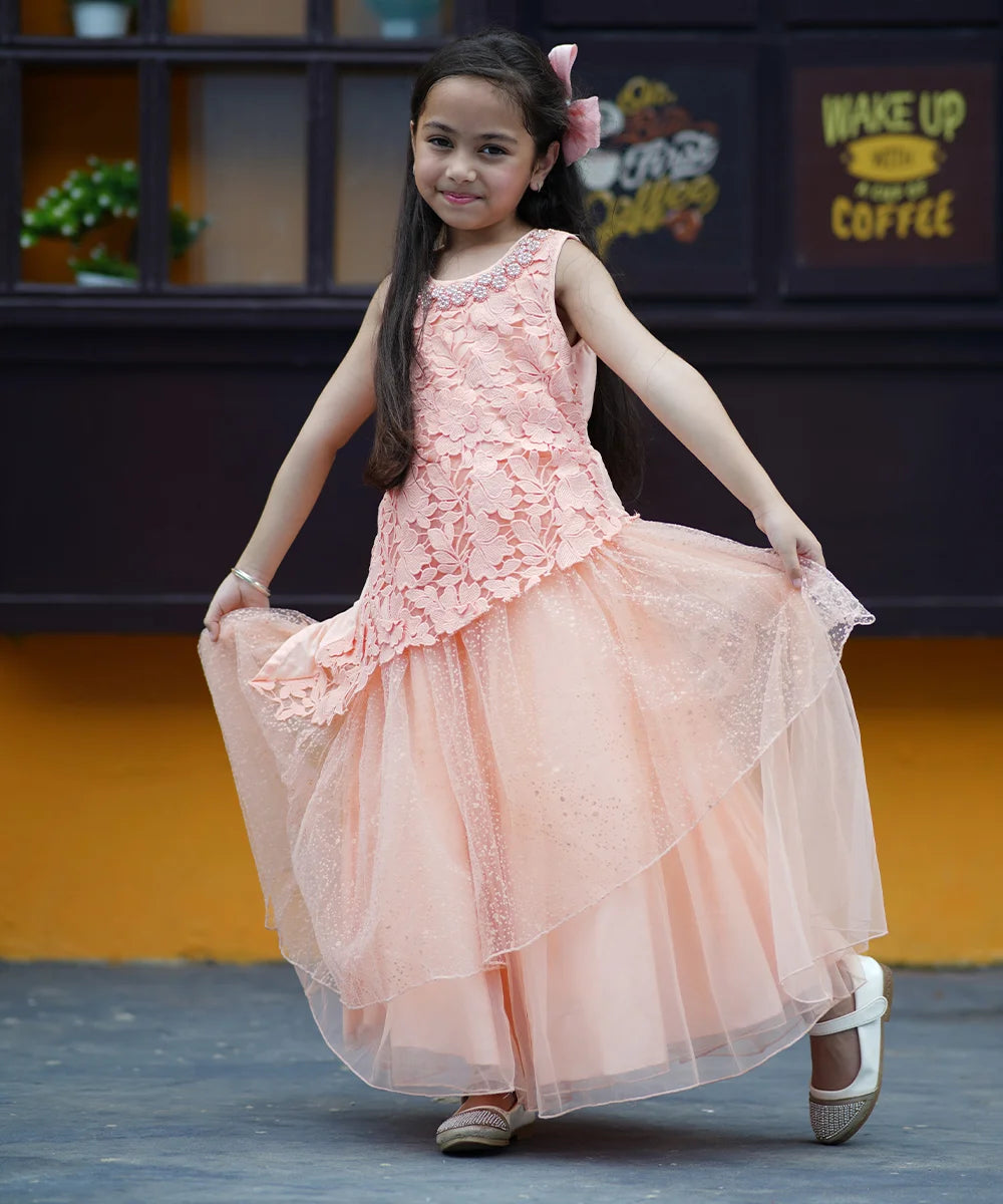 Peach Colored Laced Party Gown with stone and pearl work detailing on neck for Girls