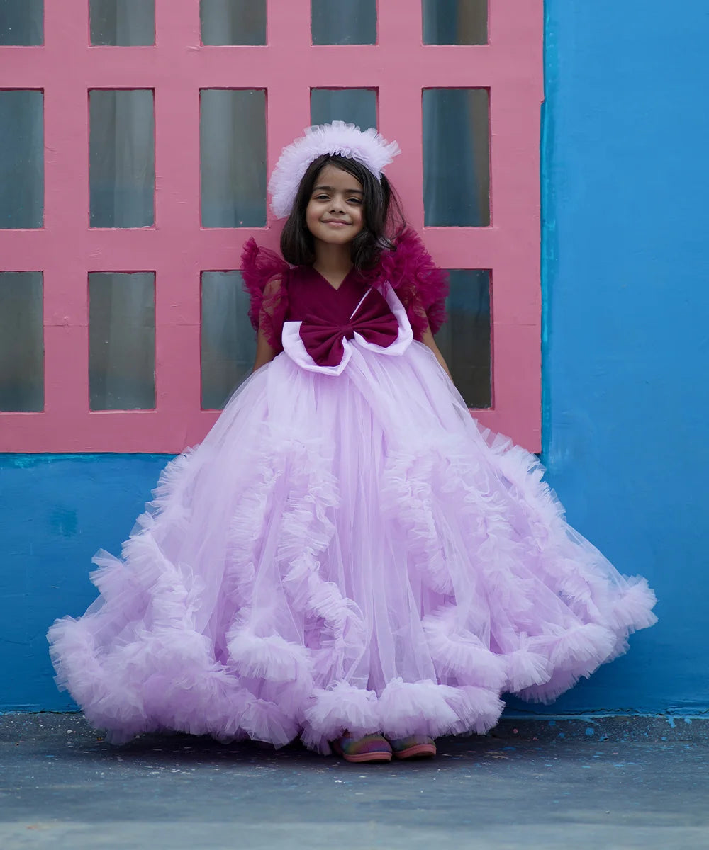 It’s a fancy frill gown, a perfect children birthday dress that comes with a matching hair accessory.