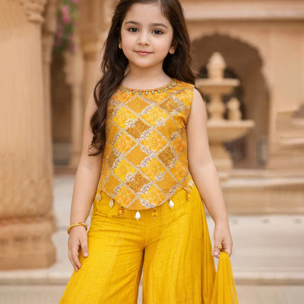 Young girl in a yellow traditional outfit standing in front of an architectural background