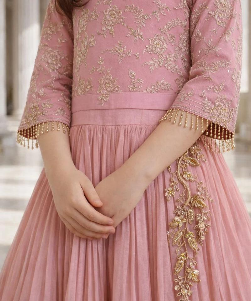 Pink traditional outfit with gold embroidery and pleated skirt