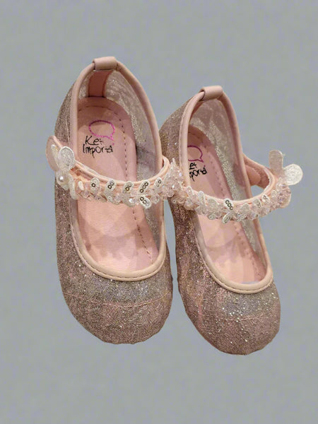 Close-up of shimmery pink dress flats for girls with sequins and flexible sole, Jaipur
