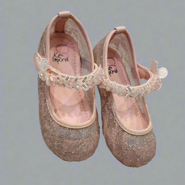Close-up of shimmery pink dress flats for girls with sequins and flexible sole, Jaipur