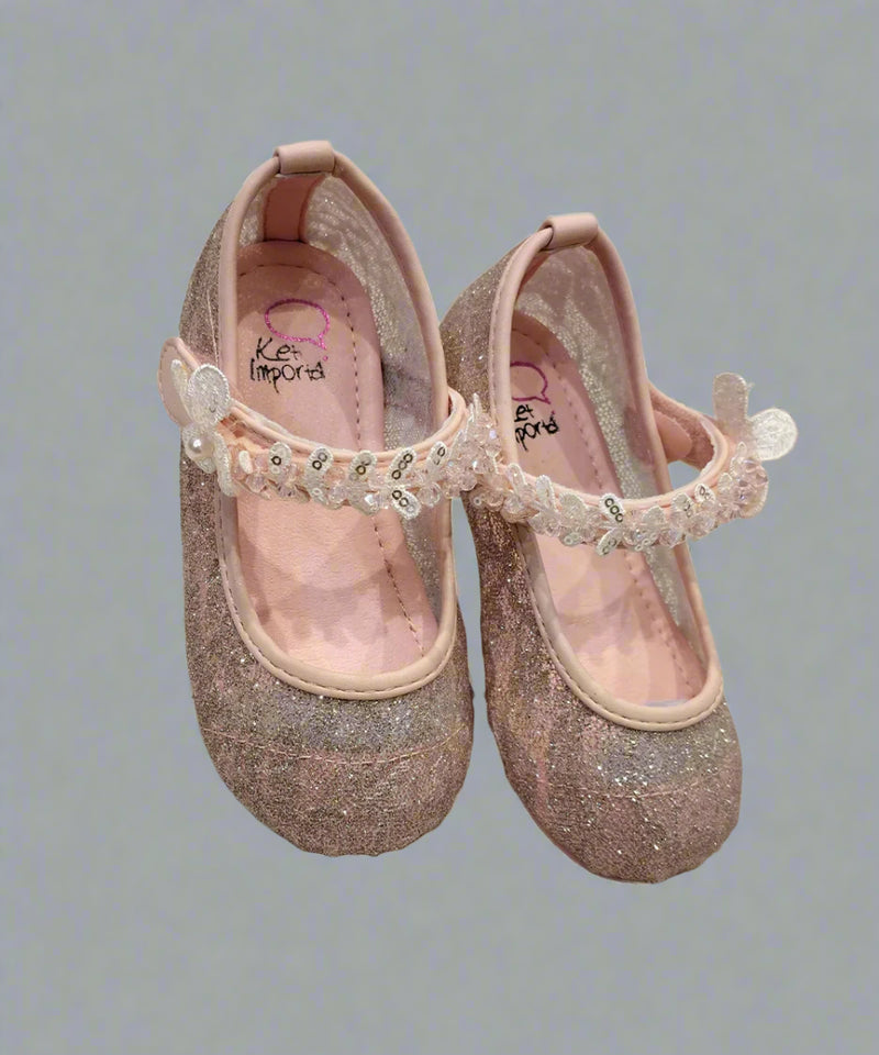 Close-up of shimmery pink dress flats for girls with sequins and flexible sole, Jaipur