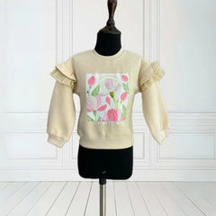 It is a beige Colored sweatshirt that has a printed detailing on it and is enhanced with sequin work.