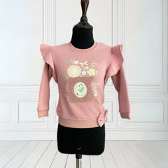 It's an onion pink Colored sweatshirt for girls that comes with a small ruffle detailing on sleeves. It features a beautiful floral print, embossed mug look and 
