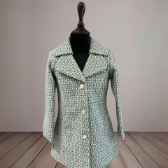 This green Colored kids winter wear consists of a self-textured warm coat with stylized matching buttons on it.