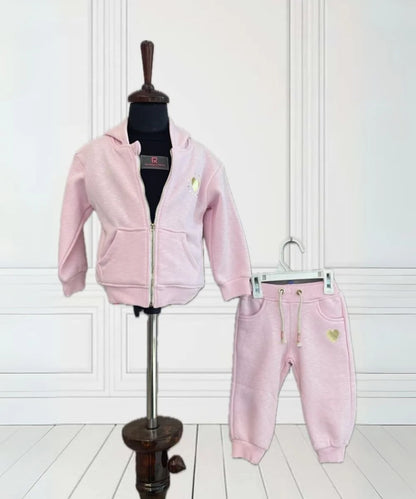 It Consists of a pink Colored lower and a sweatshirt for a little girl. This dress has a beautiful sweatshirt comes with a front zip closure and a hoodie.