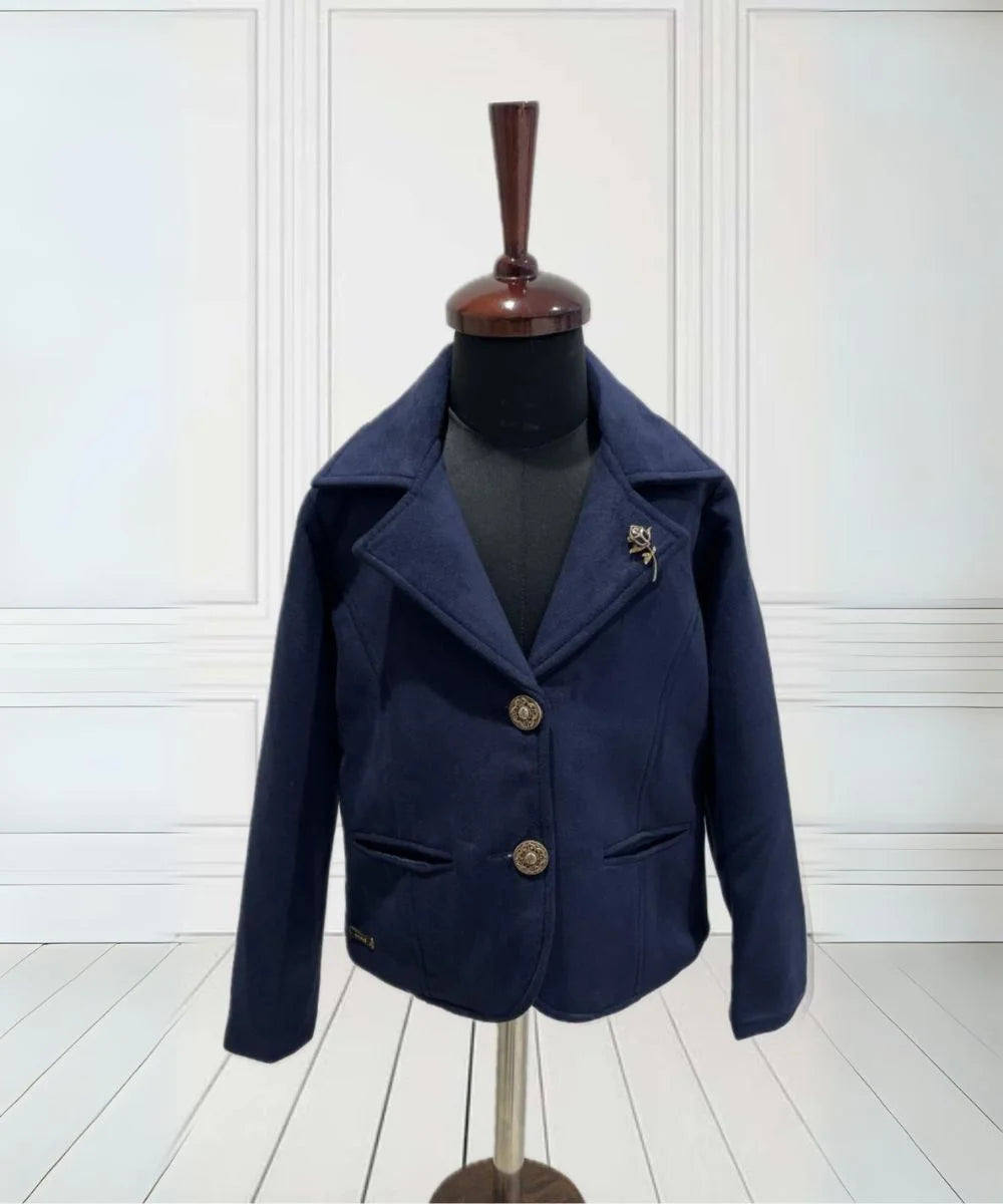 It's a navy blue Coat for baby girls that comes with a cute broach and is a perfect party wear for girls.