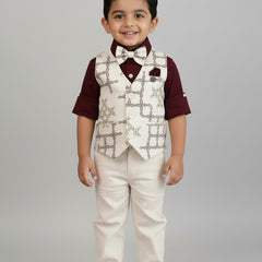 Young boy in formal attire with vest and bow tie on a gray background