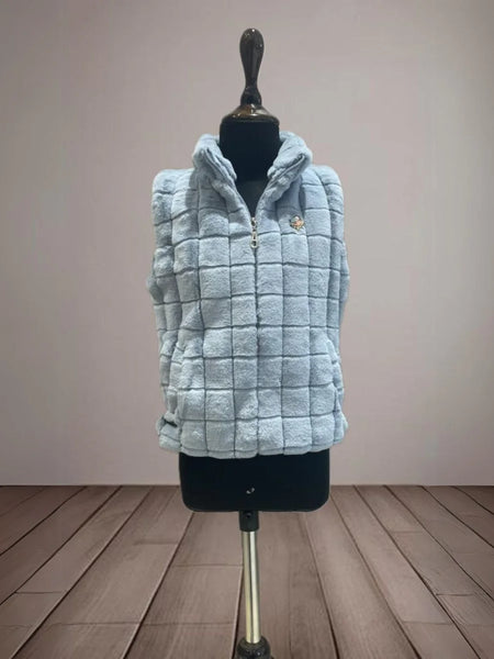 It's a beautiful blue colored self-checked warm jacket for girls perfect for winters.