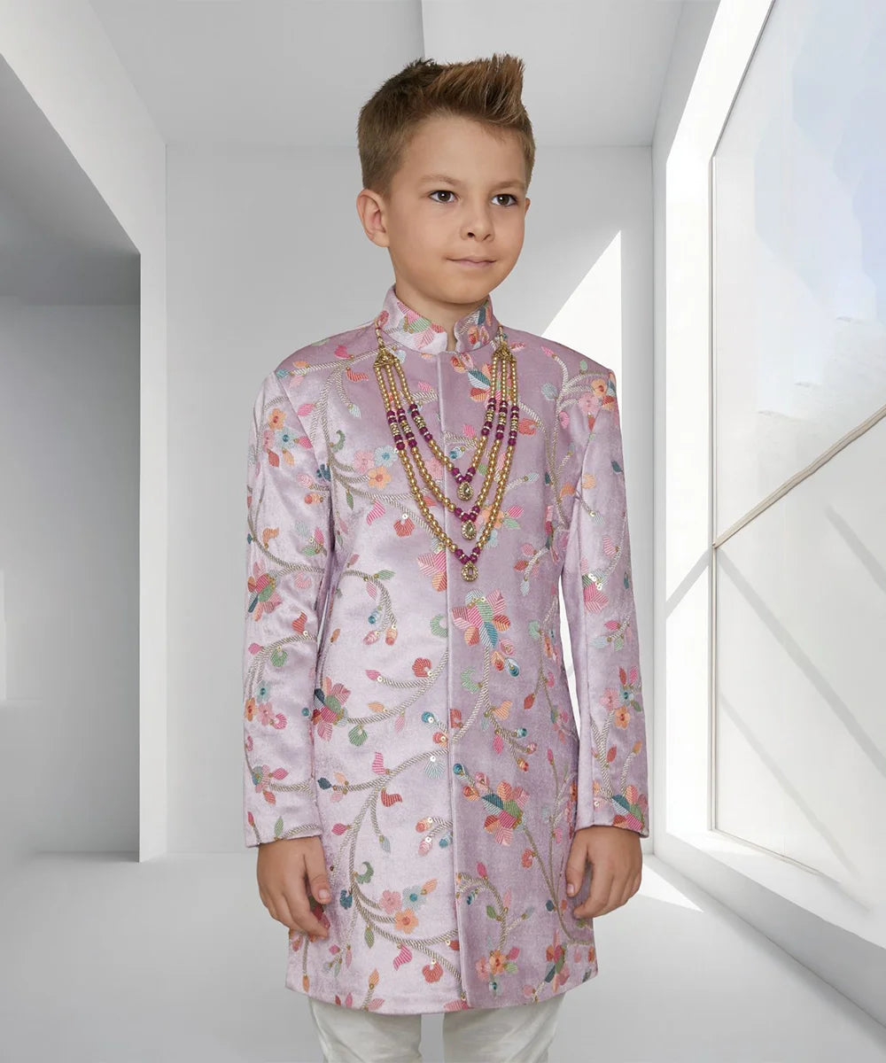  This baby sherwani suit consists of a self-printed Sherwani and a white Colored Pyjama. It features stylized buttons on the sherwani that uplift the entire look.