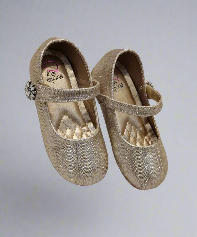 Elegant girls' gold ballerina shoes featuring a glittery finish and decorative strap, Jaipur