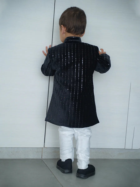 back view of black color velvet achkan 