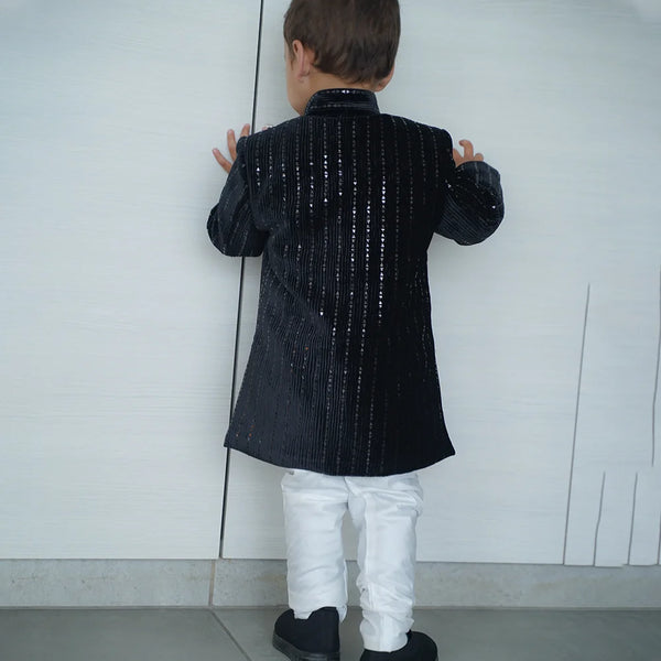back view of black color velvet achkan 