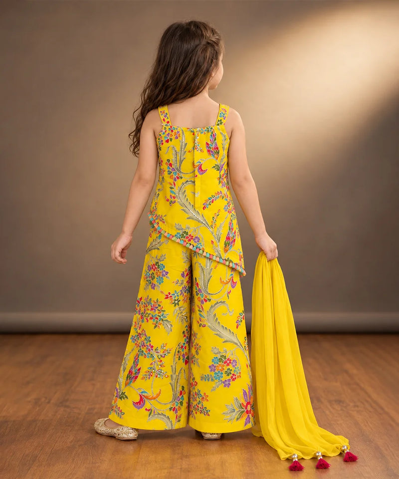 Close-up of colourful flower thread embroidery on yellow girls kurta