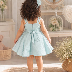 Back view of a pastel blue baby girl party frock with a sleeveless design and a flowing skirt