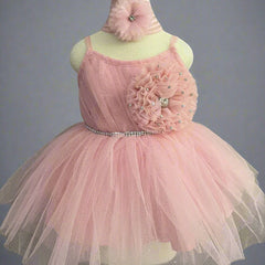It's a peach Colored frock that features shinny lace, big flower and pleated detailing. Moreover, it comes with an attached belt to be tied at the back.