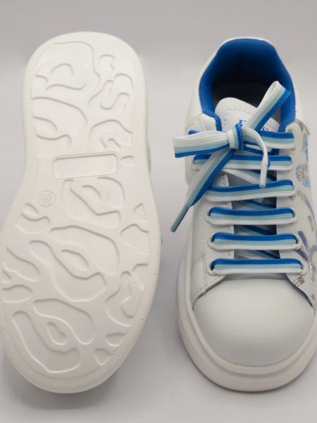 Close-up of kids' fashion sneakers with blue cartoon design and white sole, Jaipur