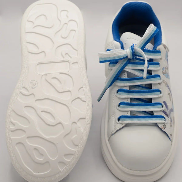 Close-up of kids' fashion sneakers with blue cartoon design and white sole, Jaipur