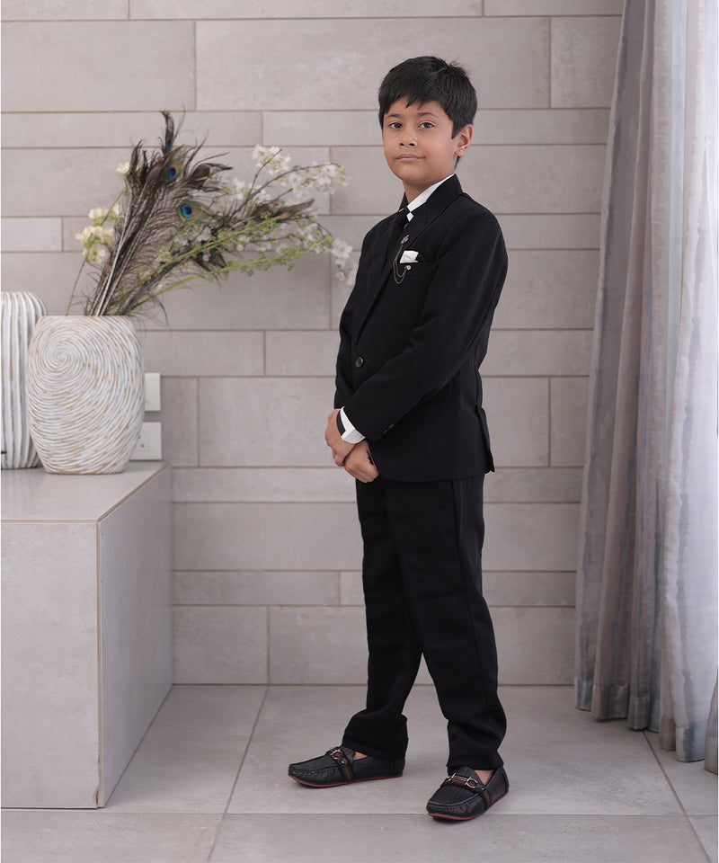 side view of black coat suit set for boys
