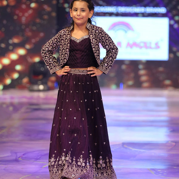 Young girl in a dark purple lehenga