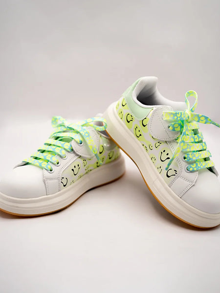 White girls' sneakers with smiley face print and neon green patterned laces, Jaipur, ages 1–8 years