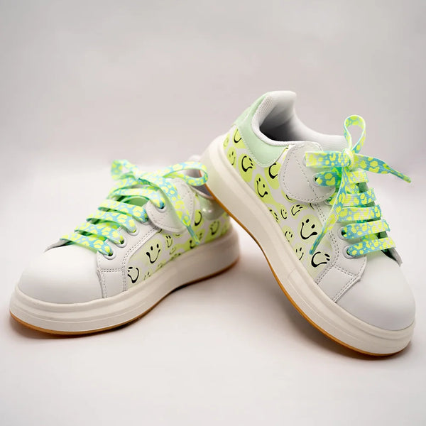 White girls' sneakers with smiley face print and neon green patterned laces, Jaipur, ages 1–8 years
