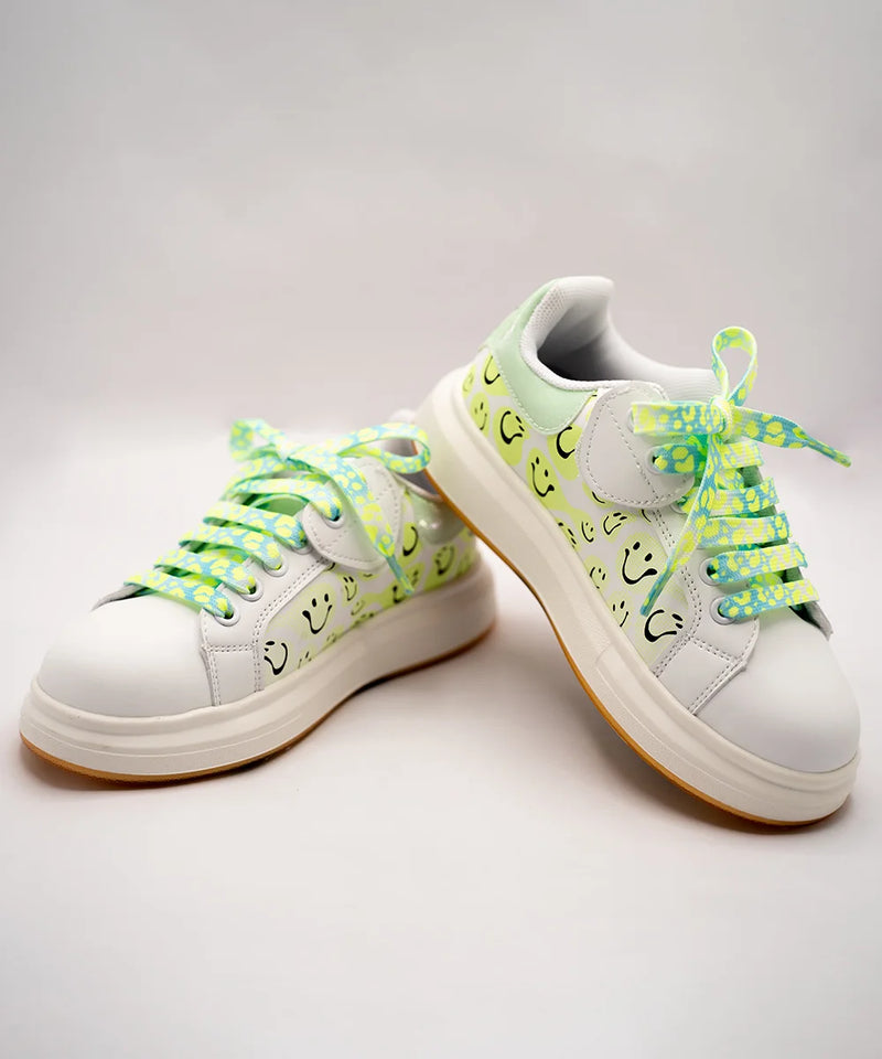 White girls' sneakers with smiley face print and neon green patterned laces, Jaipur, ages 1–8 years