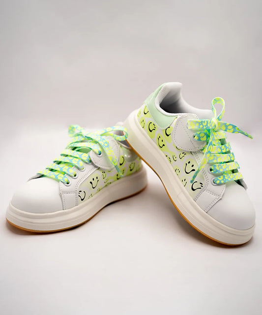 White girls' sneakers with smiley face print and neon green patterned laces, Jaipur, ages 1–8 years