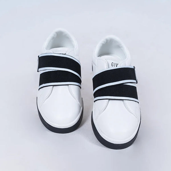Kids' modern white and black sneakers featuring bold straps and cushioned sole, Jaipur