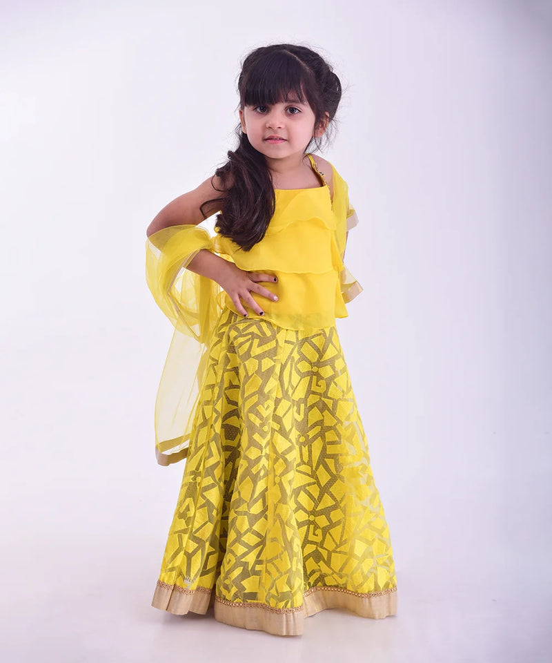 Best yellow lehenga for kids wedding in Jaipur, layered choli and gold lace accents