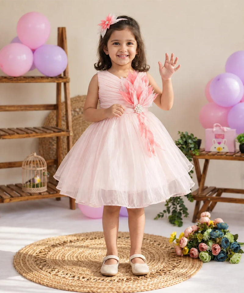 Sleeveless design on light pink net frock for baby girls