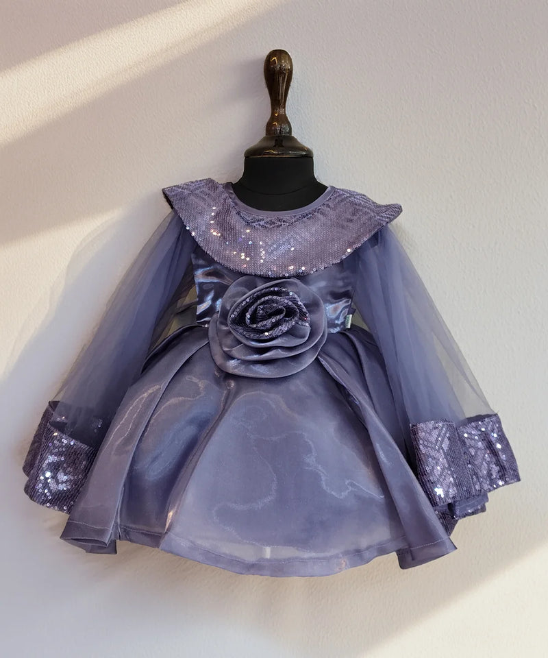Lavender dress with sequin details on a mannequin against a white background