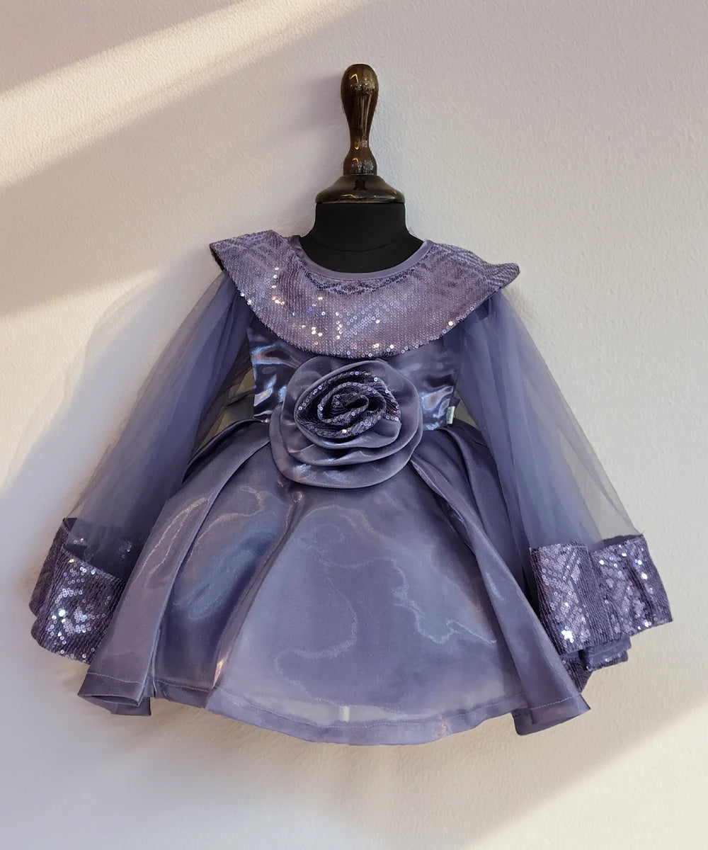 Lavender dress with sequin details on a mannequin against a white background