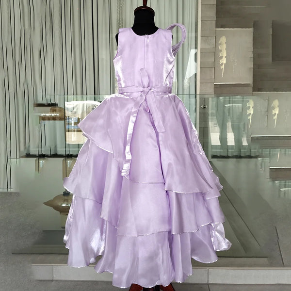 Lavender dress on a mannequin in an indoor setting with reflective floor and wall.