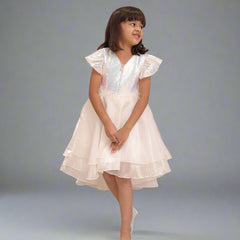 It's a cute white coloured up-and-down birthday frock with a back zip closure. A perfect marriage wears for girls. It features a bow on the back and beautiful feather detailing on the waist that uplifts the entire look.